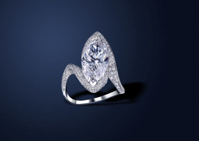 Marquis cut diamond ring set in platinum. Ring is paved with pure white round diamonds.